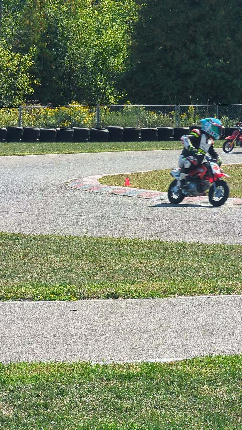 Two riders working through the back section as the light goes long
