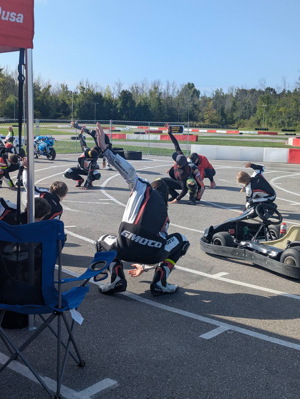 Riders stretching together in the paddock before the endurance race at Brechin