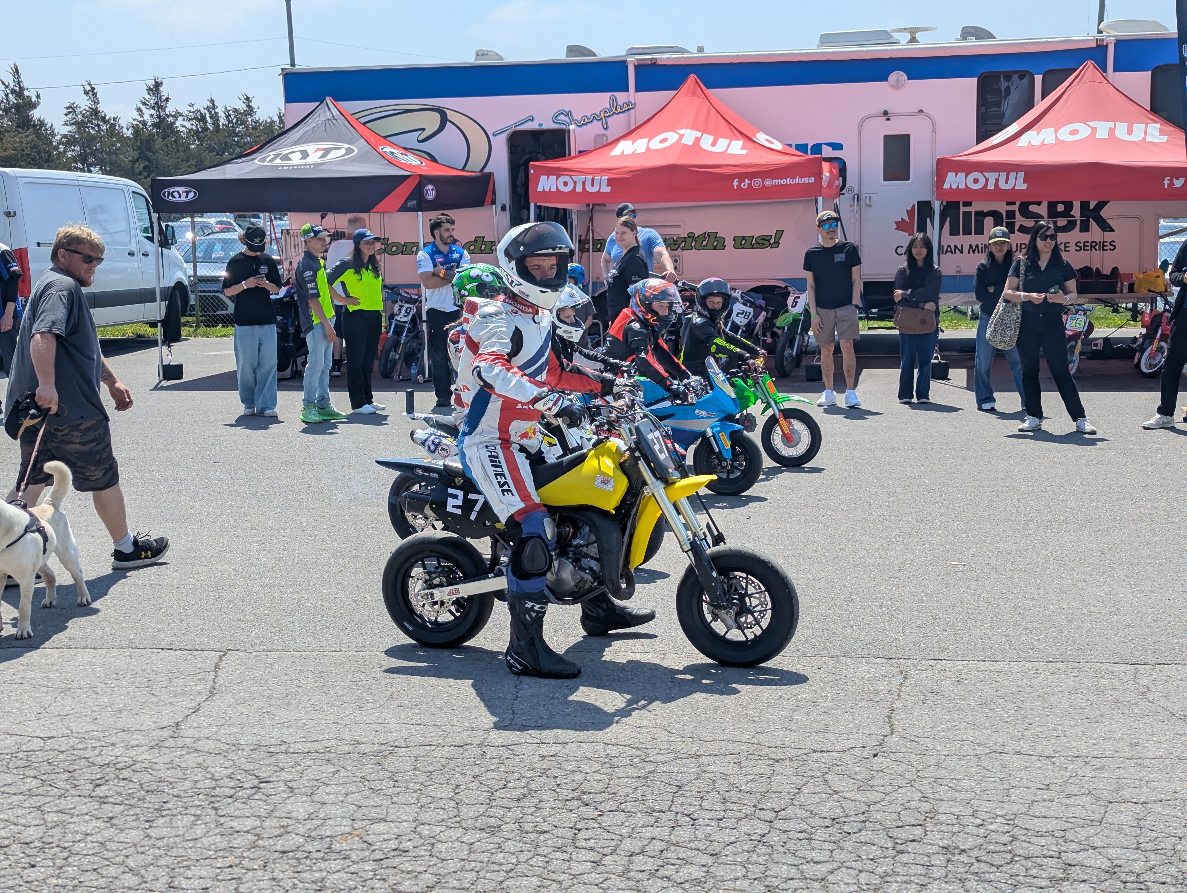 Awnings, bikes and families filling the MiniSBK paddock